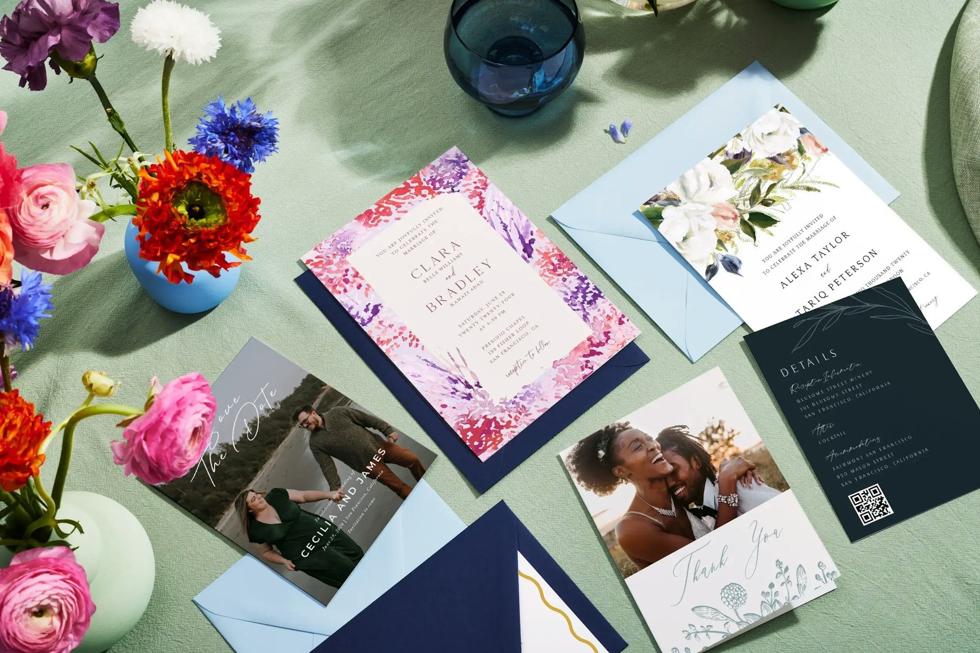 Flat lay of invitations and envelopes with a bouquet of flowers